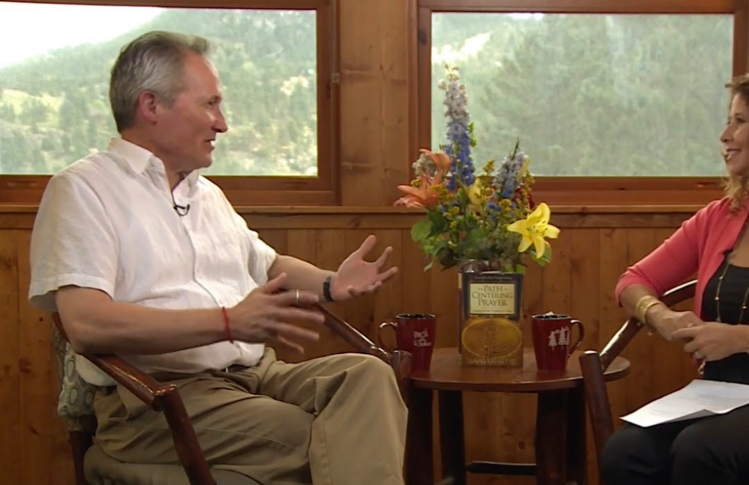 David Frenette sitting in a chair speaking to a person out of the picture