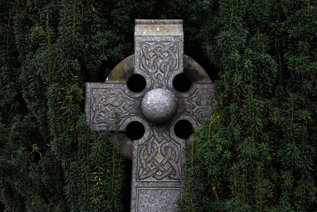 Ancient celtic cross nestled in a bush