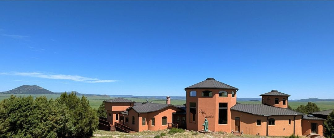Charis Mandala Sanctuary with a small hill in the background.<br />