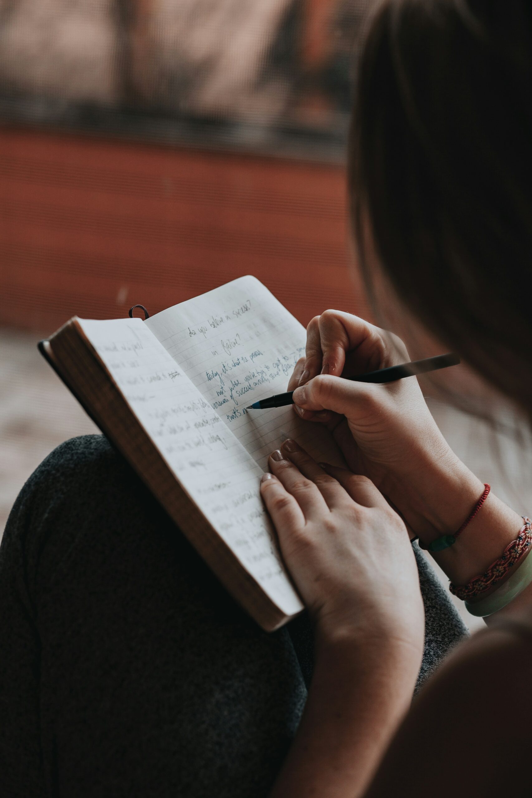 woman taking notes