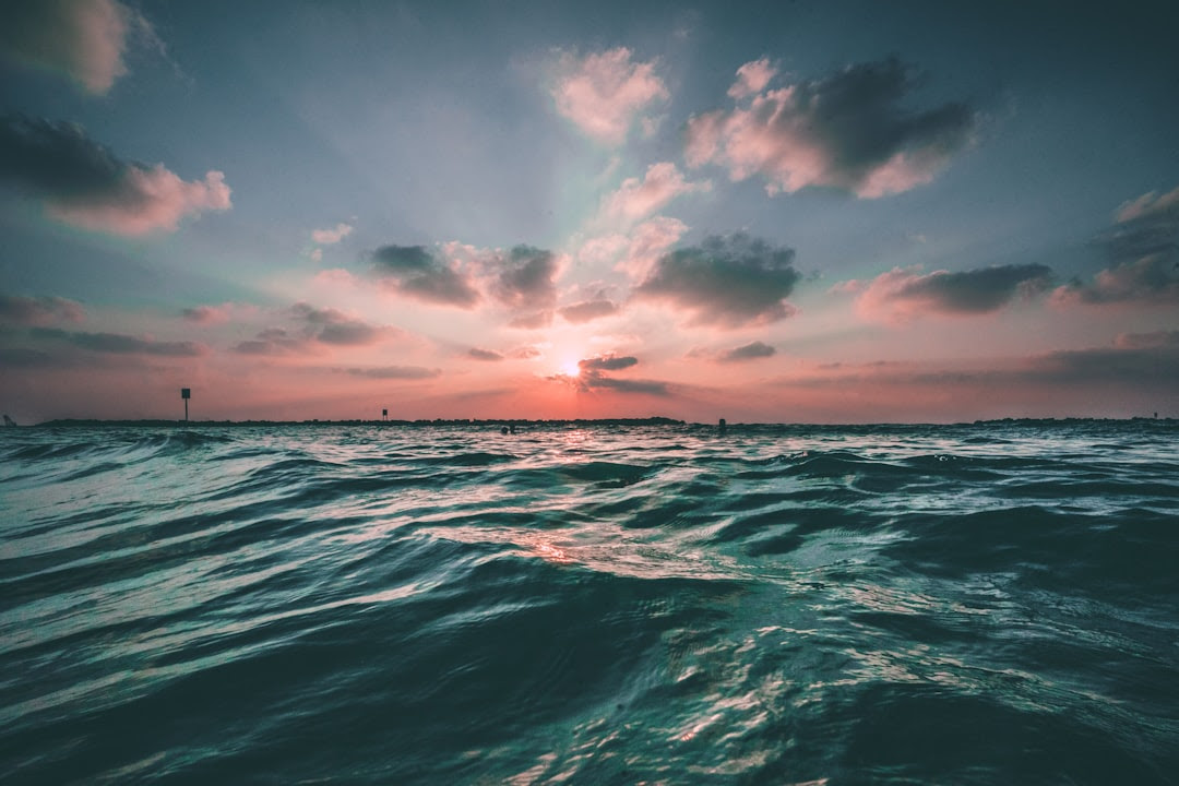 Ocean with pink sunset
